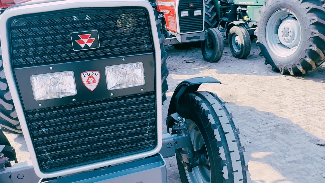Front wheel and grille of an MF 385 Deluxe tractor in an archive photograph